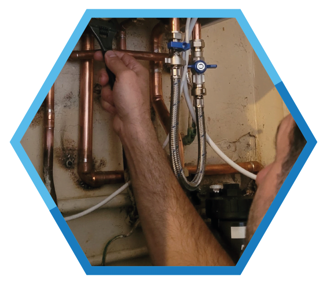 Josh from Helix plumbing Swansea servicing a boiler